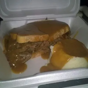 a sandwich in a styrofoam container