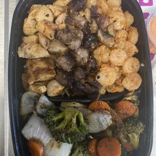 Rocky's Hibachi Meal w/t chicken , steak and shrimp with broccoli,carrots, zucchini,onions and mushrooms.