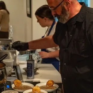 Chef finishing a dish