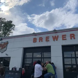 people eating outside of a restaurant