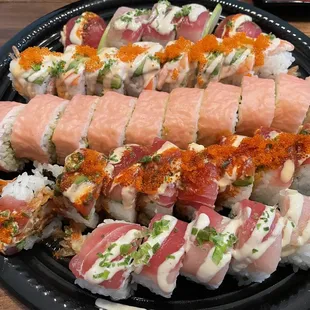 Large Omakase Platter 2 of 2. The red balls and nigiri are good, rice a little hard, and the rolls are ok. $110 delivered.
