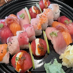 Large Omakase Platter 1 of 2. The red balls and nigiri are good, rice a little hard, and the rolls are ok. $110 delivered.