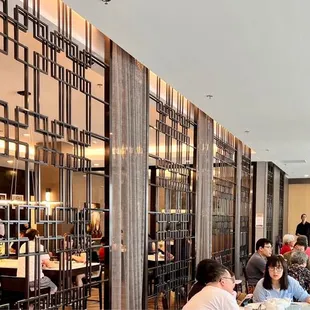 Nice decorative wall, but it blocks the staff from seeing you wave for their assistance.