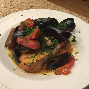 Saute' mussels with San Marzano filets, Thai curry over Italian toasted bread