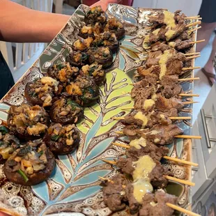 Sausage spinach stuffed mushrooms and Garlic Mustard Steak Skewers. The beef skewers were so tender and good.