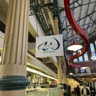 a sign hanging from the ceiling