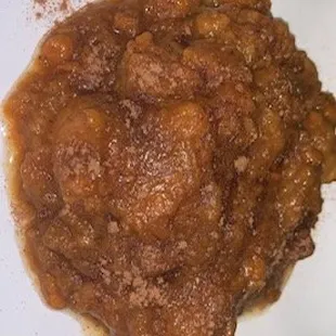 a plate of food with beans and meat