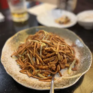 a plate of stir fried noodles