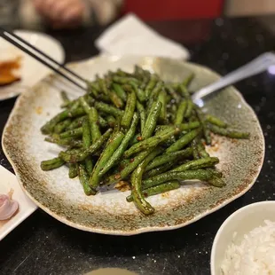 a plate of green beans and rice