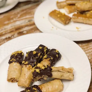 Mediterranean X Asian; Bakllios, an original creation for the guest of honor. orange-infused honey EVOO Baklava Rolls dipped in dark choco