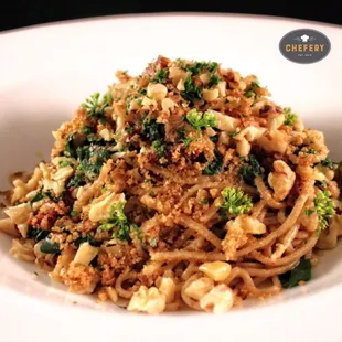 Vegetarian spelt pasta with sun dried tomato, kale, parsley, garlic, walnuts and Pecorino Romano.