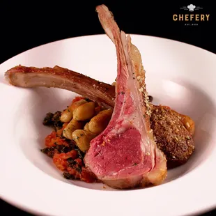 Roasted rack of lamb crusted with mint and almonds over chickpea gnocchi and Moroccan tomato sauce