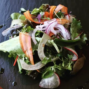 Beautiful local greens mixed with shaved seasonal vegetables their nutritional integrity, served with balsamic vinaigrette