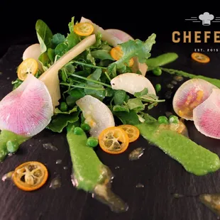 Spring peas, arugula, pea tendrils, mint, watermelon radish, artichokes, kumquats and feta cheese with kumquat-peppercorn vinaigrette