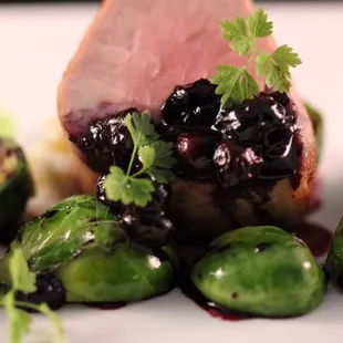 Pork tenderloin with celeriac, Brussels sprouts and a sweet-tart wild huckleberry sauce.