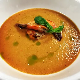 Vine ripened heirloom tomato blended and chilled to create a bright and refreshing chilled summer soup, served with grilled prawns