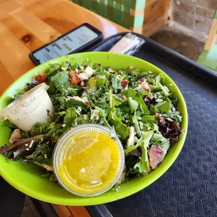 a plate of salad with dressing