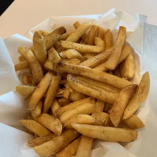 Fries with black pepper. Glad they don't salt them.