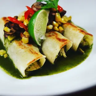 a plate of food that includes burritos