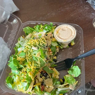 a salad in a plastic container