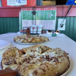 8" signature pizzas are only $10. Foreground 8" Buffalo Chicken Pizza and background is 8" Hot Brown Pizza