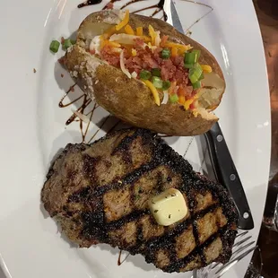 Truffled NY strip with loaded baked potato