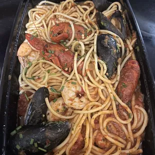 Spicy Seafood Spaghetti with shrimp, mussels, and crawfish.