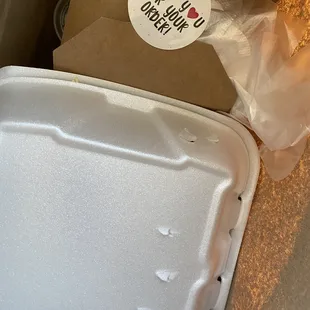 The takeout order comes in elegant packaging, including a glove to keep your fingers clean when eating the spicy wings!