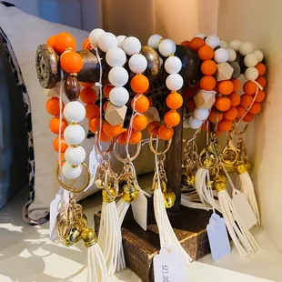 orange and white beads and tassels