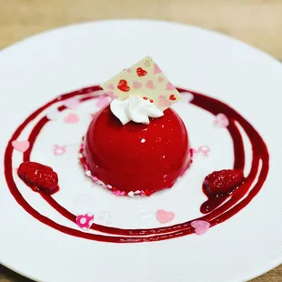 a red dessert on a white plate