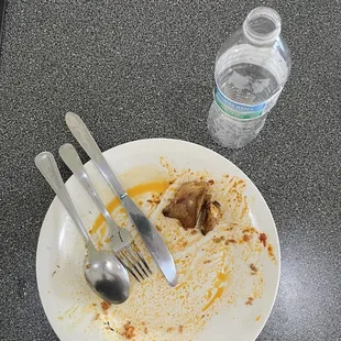 Jollof rice with peppered goat and plantains....or what's left of it.  AMAZING!