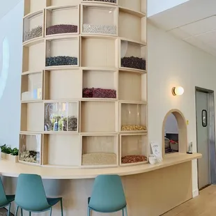a counter and chairs in a restaurant