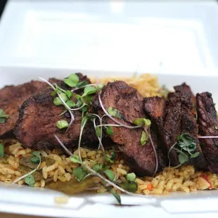 a meal in a styrofoam container