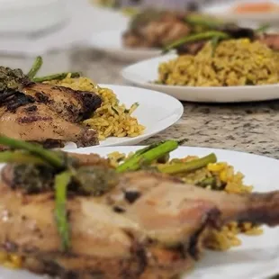 Vegetable fried rice, grilled asparagus and charred-baked cornish hen.