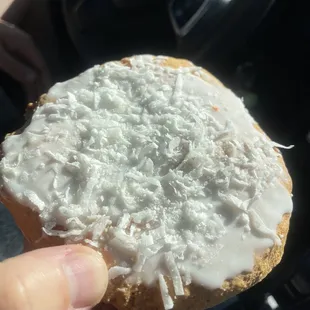  a hand holding a pastry