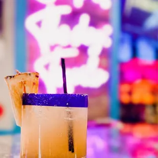 a cocktail with a pineapple garnish