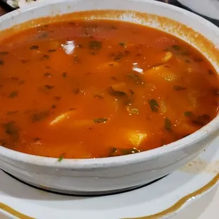 a bowl of soup and a plate of rice