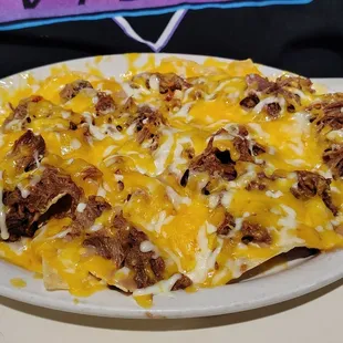 Shredded Beef Grande Nachos were delicious! Also includes sour cream, guacamole and jalapenos.