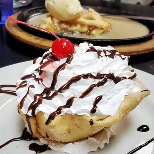 Fried Ice Cream - Vanilla ice cream and Corn Flakes rolled in house, flash fried and topped with whipped cream, chocolate, and a cherry