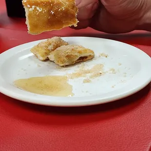 The sopaipilla with honey.