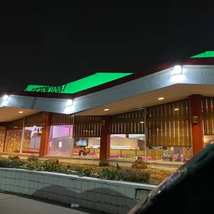 a car parked in front of the restaurant