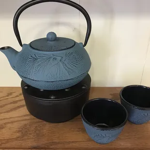 a teapot and two cups