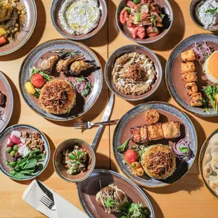 a variety of dishes of food on a table