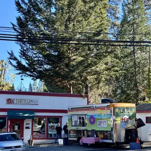 a food truck parked on the side of the road