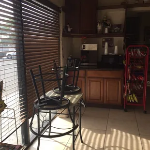 a table and chairs in front of a window