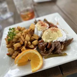 Texas Steak Benedict with brunch potatoes and the Heavens Gate Old Fashioned...
