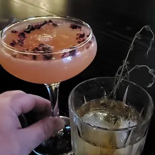 Maple infused bourbon cocktail with rosemary and a tequila martini with dried rose petals both from their menu