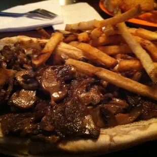 a beef sandwich with fries