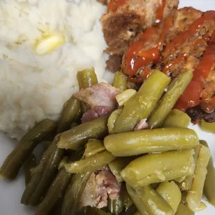 Homemade meatloaf, mashed potatoes, and green beans.