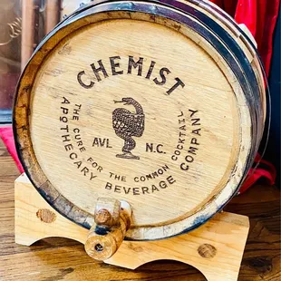 a wooden barrel on a stand